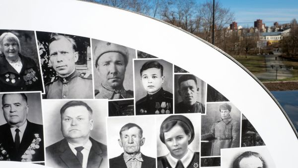 A fragment of a ten-meter installation with photographs of participants in the Great Patriotic War installed in the eternal flame at the memorial complex Eternal Flame of Glory and the Tomb of the Unknown Soldier in Petrozavodsk. A fragment of a ten-meter installation with photographs of participants in the Great Patriotic War installed in the eternal flame at the memorial complex Eternal Flame of Glory and the Tomb of the Unknown Soldier in Petrozavodsk. - Sputnik International