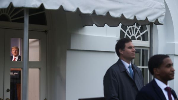 U.S. President Donald Trump speaks during the daily coronavirus task force briefing as two U.S. Secret Service agents stand guard outside the briefing room at the White House in Washington, U.S., April 22, 2020 - Sputnik International