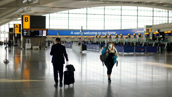 A woman wearing a mask is seen at Heathrow airport, London, Britain, April 5, 2020. A woman wearing a mask is seen at Heathrow airport, London, Britain, April 5, 2020. - Sputnik International