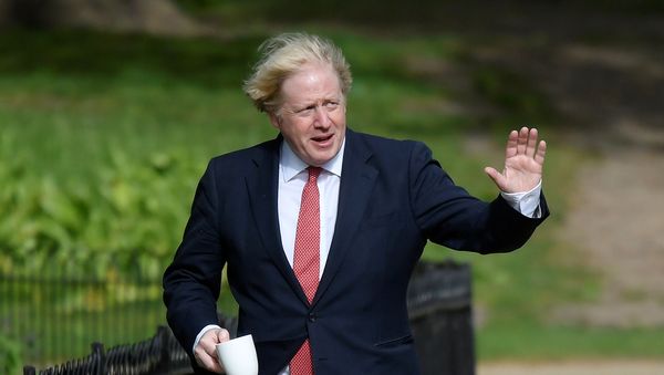 Britain's Prime Minister Boris Johnson waves as he goes for a walk in Central London following the outbreak of the coronavirus disease (COVID-19), London, Britain May 11, 2020. REUTERS/Toby Melville Britain's Prime Minister Boris Johnson waves as he goes for a walk in Central London following the outbreak of the coronavirus disease (COVID-19), London, Britain May 11, 2020. REUTERS/Toby Melville - Sputnik International