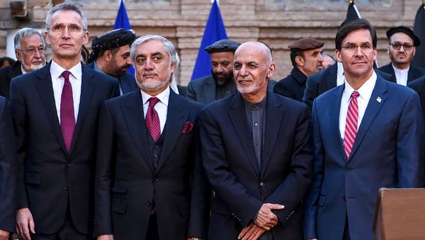 NATO Secretary General Jens Stoltenberg (L) pose along with Afghan presidential election opposition candidate Abdullah Abdullah (2L), Afghanistan's President Ashraf Ghani (2R) and US Secretary of Defense Mark Esper (R) after a press conference at the presidential palace in Kabul on February 29, 2020. - Sputnik International