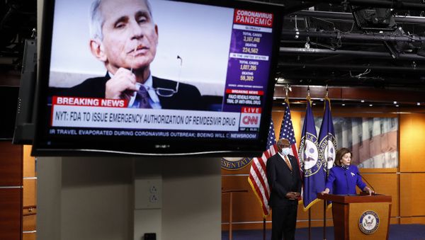 House Speaker Nancy Pelosi of Calif., speaks alongside House Majority Whip James Clyburn of S.C., as an image of Dr. Anthony Fauci, director of the National Institute of Allergy and Infectious Diseases, is displayed on a television during a news conference on Capitol Hill in Washington, Wednesday, April 29, 2020. Pelosi held the news conference to announce members of the House Select Committee on the Coronavirus Crisis. - Sputnik International