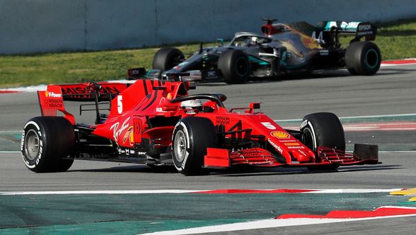 FILE PHOTO: Formula One F1 - Pre Season Testing - Circuit de Barcelona-Catalunya, Barcelona, Spain - February 26, 2020 Ferrari's Sebastian Vettel and Mercedes' Lewis Hamilton during testing - Sputnik International