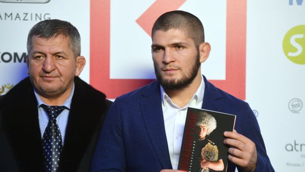 Abdulmanap Nurmagomedov and Khabib Nurmagomedov   - Sputnik International