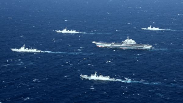 This aerial photo taken on January 2, 2017 shows a Chinese navy formation, including the aircraft carrier Liaoning (C), during military drills in the South China Sea This aerial photo taken on January 2, 2017 shows a Chinese navy formation, including the aircraft carrier Liaoning (C), during military drills in the South China Sea - Sputnik International