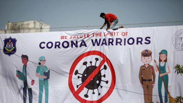 A worker installs a hoarding thanking frontline workers during a nationwide lockdown to slow the spreading of the coronavirus disease (COVID-19), in Ahmedabad, India, A worker installs a hoarding thanking frontline workers during a nationwide lockdown to slow the spreading of the coronavirus disease (COVID-19), in Ahmedabad, India, - Sputnik International