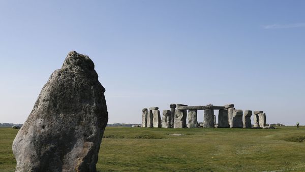 Security guards patrol the prehistoric monument at Stonehenge in southern England, on April 26, 2020, closed during the national lockdown due to the novel coronavirus COVID-19 pandemic - Sputnik International