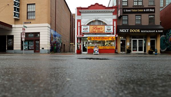 The sidewalk is seen empty during dinner hour at Ben's Chili Bowl, whose founders Ben and Virginia Ali famously kept the restaurant running through very difficult times in the past, as the eatery navigates the coronavirus disease (COVID-19) outbreak with no seating, limited hours and help from a federal Payroll Protection Program Loan in Washington, U.S. April 30, 2020. - Sputnik International