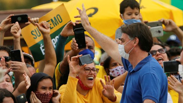 Brazil's President Jair Bolsonaro greets supporters during a protest against the President of the Chamber of Deputies Rodrigo Maia, Brazilian Supreme Court, quarantine and social distancing measures, amid the coronavirus disease (COVID-19) outbreak, in Brasilia, Brazil May 17, 2020 Brazil's President Jair Bolsonaro greets supporters during a protest against the President of the Chamber of Deputies Rodrigo Maia, Brazilian Supreme Court, quarantine and social distancing measures, amid the coronavirus disease (COVID-19) outbreak, in Brasilia, Brazil May 17, 2020 - Sputnik International