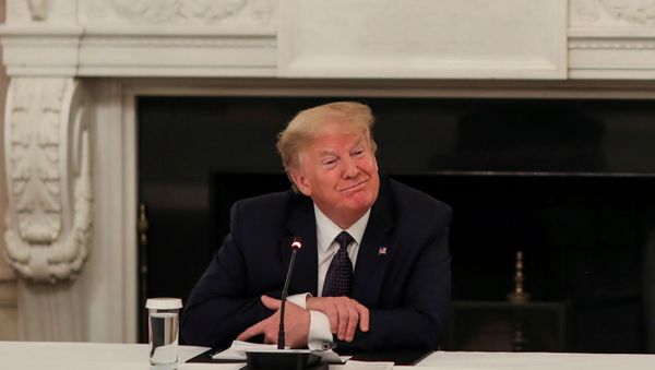 U.S. President Donald Trump speaks with restaurant executives and industry leaders during a coronavirus disease (COVID-19) pandemic meeting in the State Dining Room at the White House in Washington, U.S., May 18, 2020 - Sputnik International