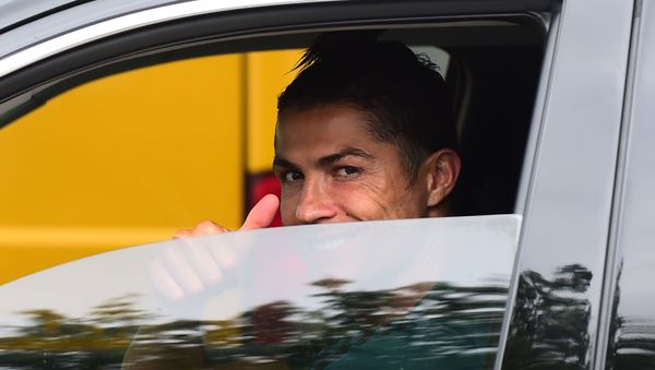 Juventus' Cristiano Ronaldo gestures as he leaves Juventus Training Center following the outbreak of the coronavirus disease (COVID-19), Turin, Italy, May 19, 2020 - Sputnik International