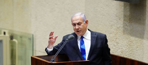 Israeli Prime Minister Benjamin Netanyahu speaks during a swearing in ceremony of his new unity government with election rival Benny Gantz, at the Knesset, Israel's parliament, in Jerusalem May 17, 2020 - Sputnik International