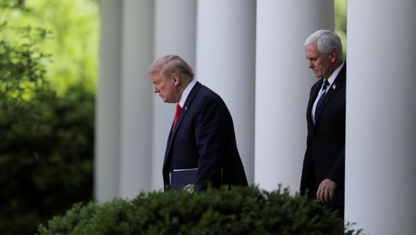 U.S. President Donald Trump is followed by Vice President Mike Pence as he arrives to discuss the administration's coronavirus response at a news conference in the Rose Garden at the White House in Washington, U.S., April 27, 2020. - Sputnik International