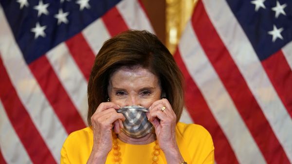 Speaker of the House Nancy Pelosi puts on her face mask to protect from the coronavirus disease (COVID-19) after taking part in a ceremonial swearing-in for Rep. Mike Garcia (R-CA) in Washington, U.S., May 19, 2020 Speaker of the House Nancy Pelosi puts on her face mask to protect from the coronavirus disease (COVID-19) after taking part in a ceremonial swearing-in for Rep. Mike Garcia (R-CA) in Washington, U.S., May 19, 2020 - Sputnik International