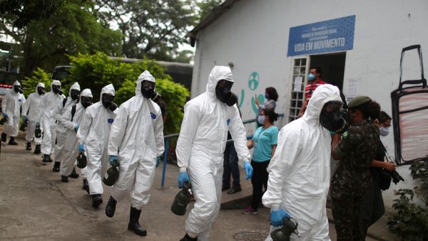  Brazilian army officers wearing protective gears arrive to disinfect the shelter Stella Maris Complex for elderly people, homeless and patients with mental disorders managed by the Rio de Janeiro City Hall amid concerns of the spread of the coronavirus disease (COVID-19), in Rio de Janeiro, Brazil May 14, 2020 - Sputnik International