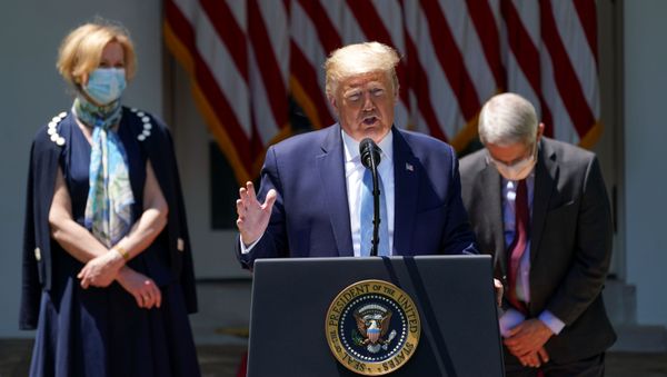U.S. President Donald Trump speaks about administration efforts to develop a coronavirus vaccine as Dr. Debbie Birx, the White House coronavirus response coordinator, and National Institute of Allergy and Infectious Diseases Director Dr. Anthony Fauci listen during a coronavirus disease (COVID-19) pandemic response event in the Rose Garden at the White House in Washington, U.S., May 15, 2020.  - Sputnik International