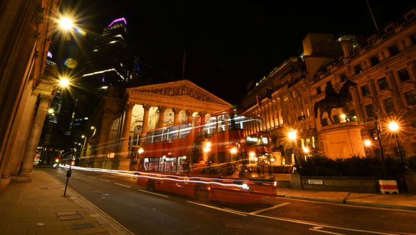 An empty bus is driven through the quiet streets outside the Bank of England in the early hours, as the city is deserted at night like never before, while the coronavirus disease (COVID-19) lockdown continues, in London, Britain April 22, 2020 - Sputnik International