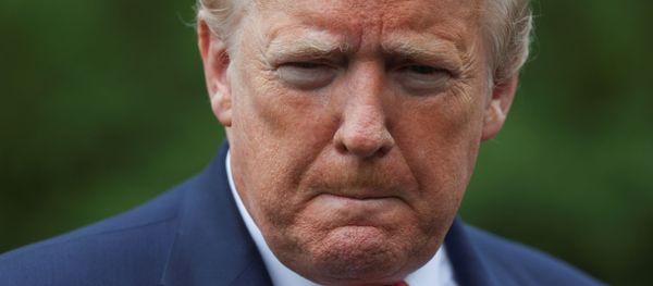 U.S. President Donald Trump talks to reporters as he departs on travel for a coronavirus disease (COVID-19) response event at a ventilator plant in Ypsilanti, Michigan from the South Lawn of the White House in Washington, U.S., May 21, 2020.  - Sputnik International