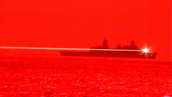 USS Portland (LPD 27) conducts a Solid State Laser - Technology Maturation Laser Weapon System Demonstrator (LWSD) test in the Pacific, May 16. (U.S. Navy) - Sputnik International