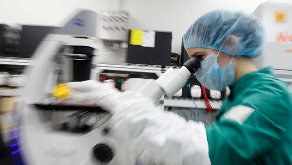A scientist examines COVID-19 infected cells under a microscope during research for a vaccine against the coronavirus disease (COVID-19) at a laboratory of BIOCAD biotechnology company in Saint Petersburg, Russia May 20, 2020 A scientist examines COVID-19 infected cells under a microscope during research for a vaccine against the coronavirus disease (COVID-19) at a laboratory of BIOCAD biotechnology company in Saint Petersburg, Russia May 20, 2020 - Sputnik International