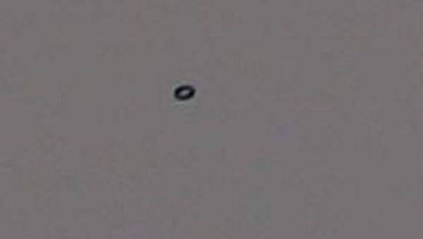 Kaz Woodall spotted a black ring in the sky (pictured) in Nimbin in far north New South Wales on Wednesday - Sputnik International