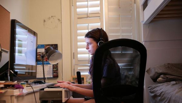 Jane Hassebroek does her schoolwork from home, which she will do for the remainder of the academic year as schools in New York remain closed, during the outbreak of the coronavirus disease (COVID-19) in Brooklyn, New York, U.S., May 6, 2020.  - Sputnik International