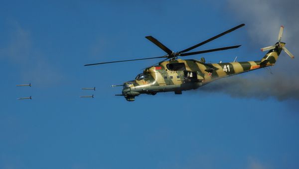 Mi-24 helicopter fires at targets during the joint Russian-Belarusian operational exercise Union Shield 2015 at a military range in Kamenka, Leningrad Region - Sputnik International
