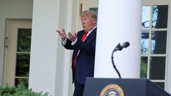 U.S. President Donald Trump beckons his guests to join him in the Oval Office after speaking about negotiations with pharmaceutical companies over the cost of insulin for U.S. seniors on Medicare at an event in the Rose Garden at the White House during the coronavirus disease (COVID-19) outbreak in Washington, U.S. May 26, 2020 - Sputnik International