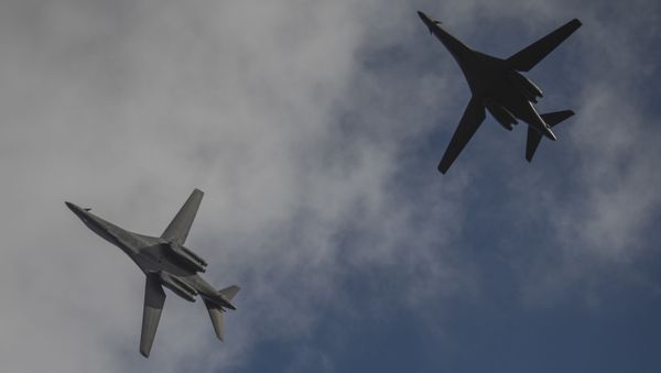 Two 9th Expeditionary Bomb Squadron B-1B Lancers fly in formation before landing at Andersen Air Force Base, Guam, May 26, 2020 after conducting a mission in the South China Sea. - Sputnik International