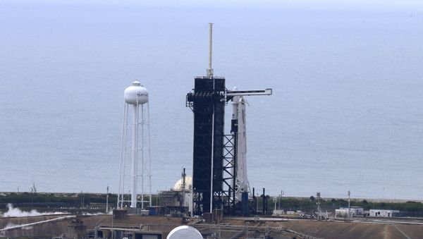 A SpaceX Falcon 9 rocket and Crew Dragon spacecraft carrying NASA astronauts Douglas Hurley and Robert Behnken is seen before scheduled launch of NASA's SpaceX Demo-2 mission to the International Space Station from NASA's Kennedy Space Center in Cape Canaveral, Florida, U.S.  May 27, 2020. REUTERS/Joe Skipper - Sputnik International