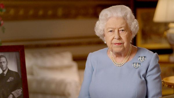 Britain's Queen Elizabeth II delivers an address to the nation and the Commonwealth on the 75th anniversary of VE Day at Windsor Castle, Britain, in this Buckingham Palace handout image released May 8, 2020 - Sputnik International