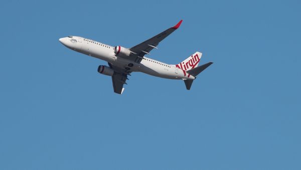 A Virgin Australia Airlines plane takes off from Kingsford Smith International Airport in Sydney, Australia, March 18, 2020 - Sputnik International