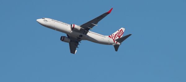 A Virgin Australia Airlines plane takes off from Kingsford Smith International Airport in Sydney, Australia, March 18, 2020 A Virgin Australia Airlines plane takes off from Kingsford Smith International Airport in Sydney, Australia, March 18, 2020 - Sputnik International