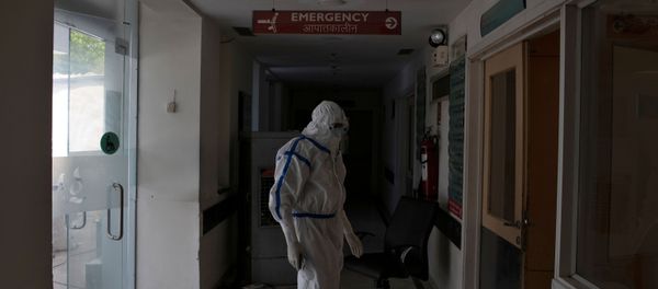 A medical worker stands outside the emergency ward for patients suffering from the coronavirus disease (COVID-19) at Max Smart Super Speciality Hospital in New Delhi A medical worker stands outside the emergency ward for patients suffering from the coronavirus disease (COVID-19) at Max Smart Super Speciality Hospital in New Delhi - Sputnik International