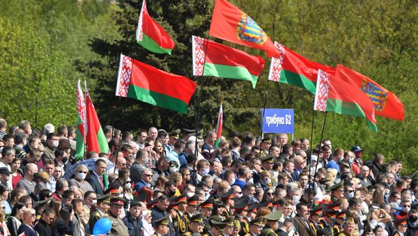 People watch at a parade marking the 75th anniversary of the victory over Nazi Germany in World War Two, in Minsk, Belarus, May 9, 2020. People watch at a parade marking the 75th anniversary of the victory over Nazi Germany in World War Two, in Minsk, Belarus, May 9, 2020. - Sputnik International