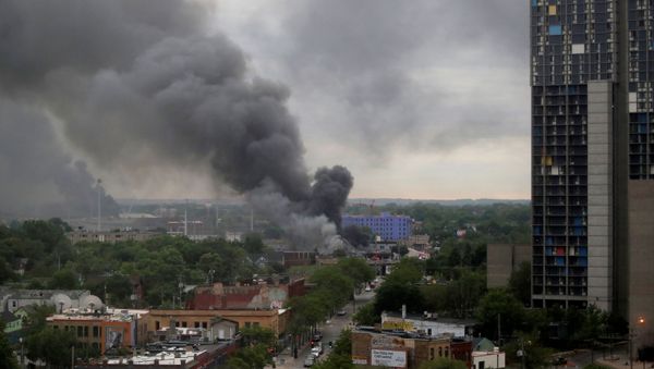 Plumes of smoke rise into the sky in the aftermath of a protest after a white police officer was caught on a bystander's video pressing his knee into the neck of African-American man George Floyd, who later died at a hospital, in Minneapolis, Minnesota, U.S., May 29, 2020. Plumes of smoke rise into the sky in the aftermath of a protest after a white police officer was caught on a bystander's video pressing his knee into the neck of African-American man George Floyd, who later died at a hospital, in Minneapolis, Minnesota, U.S., May 29, 2020. - Sputnik International