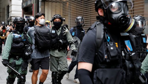 Riot police officers detain an anti-government demonstrator during a protest at Central District against the second reading of a controversial national anthem law in Hong Kong, China May 27, 2020. REUTERS Riot police officers detain an anti-government demonstrator during a protest at Central District against the second reading of a controversial national anthem law in Hong Kong, China May 27, 2020. REUTERS - Sputnik International
