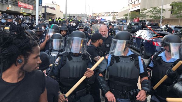 Riot police hold a line near a damaged Atlanta Police cars as people protest against the death in Minneapolis police custody of African-American man George Floyd, near CNN Center in Atlanta, Georgia, U.S. May 29, 2020 - Sputnik International