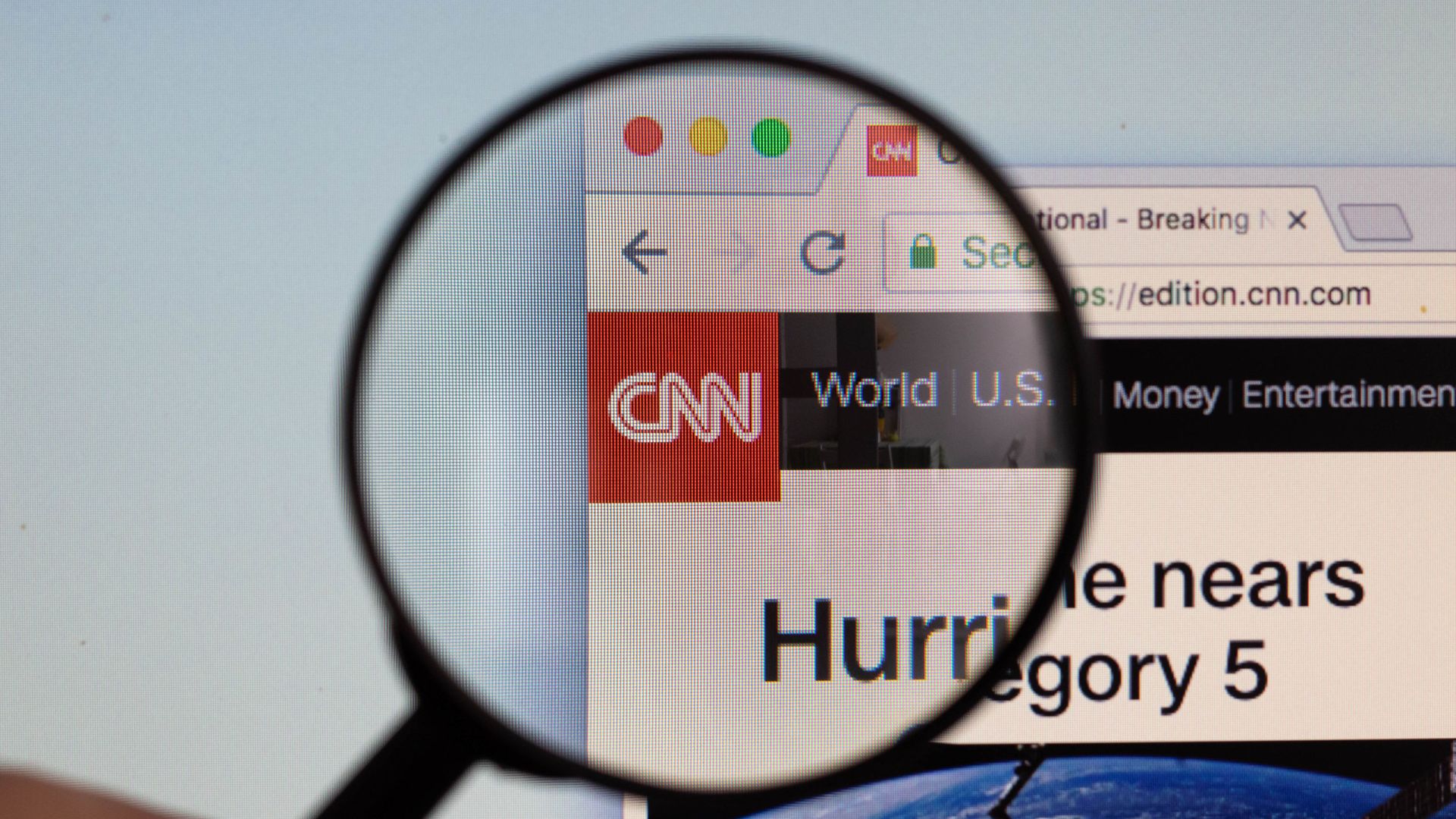 CNN logo on a computer screen with a magnifying glass CNN logo on a computer screen with a magnifying glass - Sputnik International, 1920, 27.04.2021
