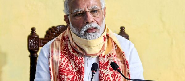 In this handout photograph taken on May 22, 2020 and released by the Indian Press Information Bureau (PIB), India's Prime Minister Narendra Modi speaks during a review meeting with officials after his aerial survey of affected areas in the state from cyclone Amphan, in Basirhat, West Bengal.  - Sputnik International