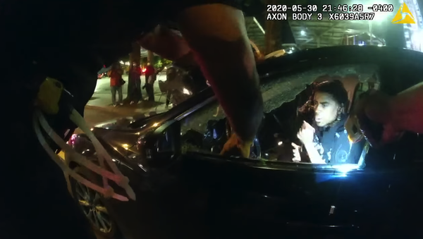 This is one officer's body camera footage released by the Atlanta Police Department showing the incident where two students were tased and pulled from their car in Downtown on May 30 during the George Floyd protests.  - Sputnik International