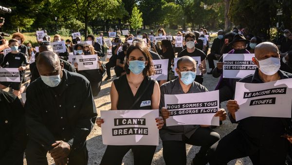 Protesters hold placards including two reading We are all George Floyd (2nd R) and Racism is suffocating us (R) during a demonstration outside the United States Embassy in Paris on June 1, 2020, after the police killing of unarmed black man George Floyd in the USA - Sputnik International