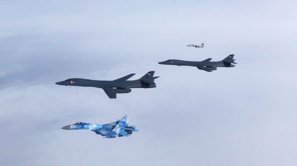 A Ukrainian Su-27 Flanker and MiG-29 Fulcrum escort two B1B Lancers during a training mission for Bomber Task Force Europe, May 29, 2020. - Sputnik International