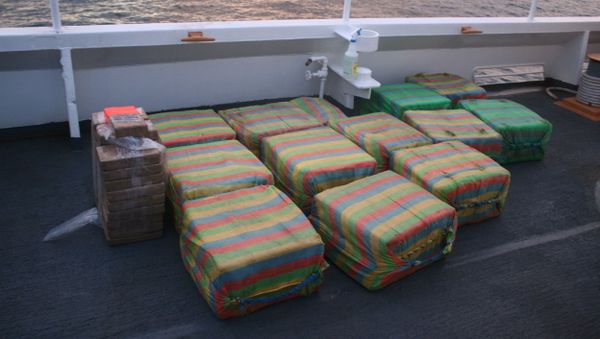 Suspected cocaine is shown on the deck of the Coast Guard Cutter Confidence in international waters of the Pacific Ocean off Central America in mid-May 2020. The Coast Guard seized approximately 1,090 pounds of suspected cocaine in mid-May with an estimated value of $18.7 million from a go-fast vessel - Sputnik International