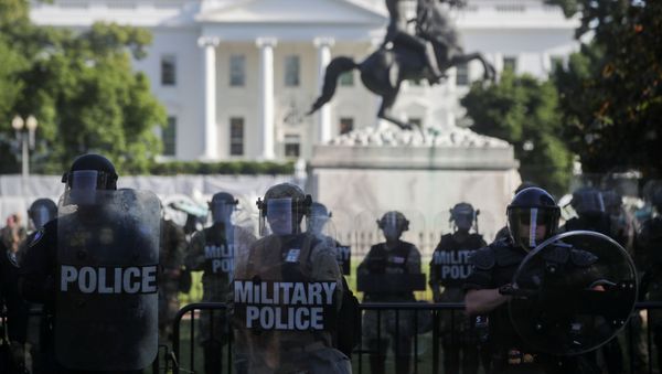 DC National Guard military police officers look on as demonstrators rally near the White House against the death in Minneapolis police custody of George Floyd, in Washington, D.C., U.S., June 1, 2020 - Sputnik International