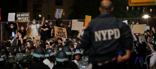 NYPD officers face demonstrators after curfew during a protest against the death in Minneapolis police custody of George Floyd, in New York City, U.S., June 2, 2020. - Sputnik International