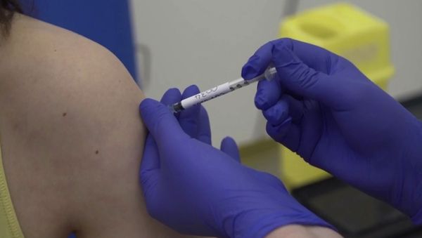 Screen grab taken from video issued by Britain's Oxford University, showing microbiologist Elisa Granato, being injected as part of the first human trials in the UK for a potential coronavirus vaccine, untaken by Oxford University, England, Thursday April 23, 2020 Screen grab taken from video issued by Britain's Oxford University, showing microbiologist Elisa Granato, being injected as part of the first human trials in the UK for a potential coronavirus vaccine, untaken by Oxford University, England, Thursday April 23, 2020 - Sputnik International
