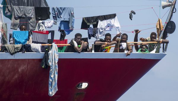 Migrants dry their clothes aboard a tourist boat some 20 kilometers from Malta, Tuesday, June 2, 2020. More than 400 migrants are living aboard pleasure cruise vessels, bobbing in the sea off Malta, many of them for weeks now. Rescued from human traffickers’ unseaworthy boats in several operations in the central Mediterranean since late April, the migrants, along with the Maltese government, are waiting for European Union countries to offer to take them. - Sputnik International