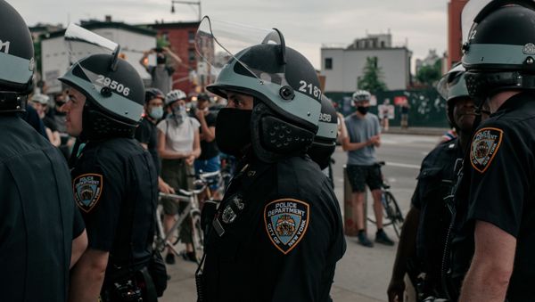 NYPD officers stand in line near a demonstration denouncing systemic racism in law enforcement in the borough of Brooklyn minutes before a citywide curfew went into effect on June 4, 2020 in New York City.  - Sputnik International