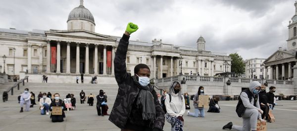 A protester makes a Black Lives Matter fist at a demonstration in Trafalgar Square in central London on June 5, 2020, to show solidarity with the Black Lives Matter movement in the wake of the killing of George Floyd, an unarmed black man who died after a police officer knelt on his neck in Minneapolis. A protester makes a Black Lives Matter fist at a demonstration in Trafalgar Square in central London on June 5, 2020, to show solidarity with the Black Lives Matter movement in the wake of the killing of George Floyd, an unarmed black man who died after a police officer knelt on his neck in Minneapolis. - Sputnik International